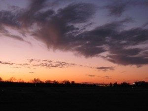 Dark clouds above red glow of sunset