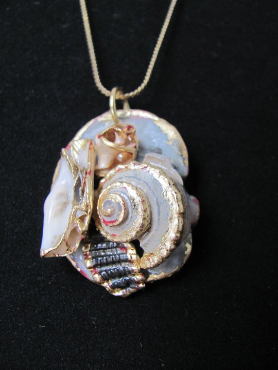 bluish shell pendant with gold edging